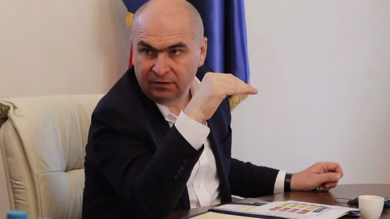 2 premieri de dreapta față in față: Bolojan pune taxe peste taxe și taie investițiile, Merz nu mărește nici o taxă și crește investițiile